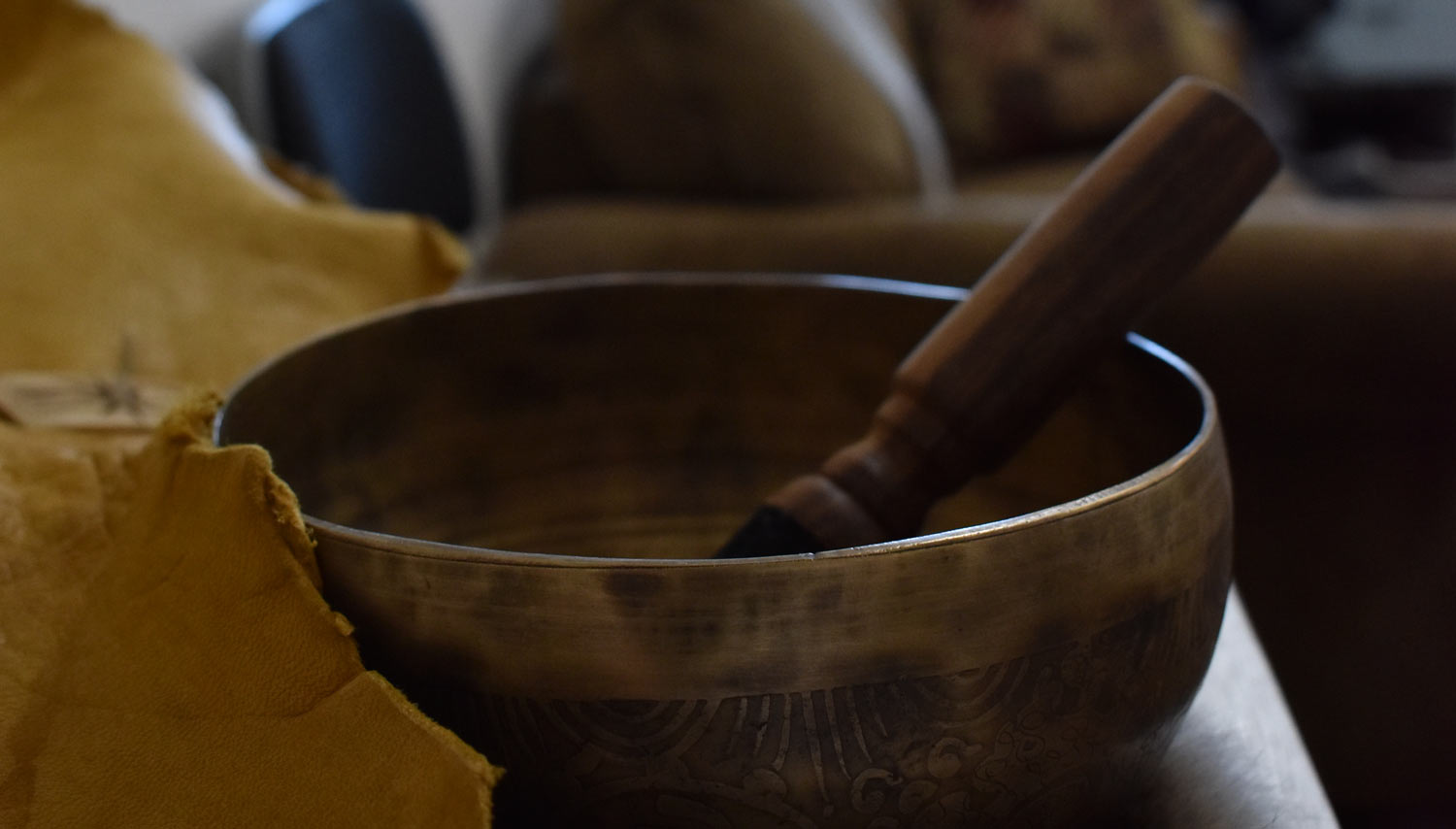 A close-up of a Tibetan singing bowl used for sound therapy, a holistic healing practice that promotes deep relaxation, stress reduction, and mindfulness through sound and vibration.