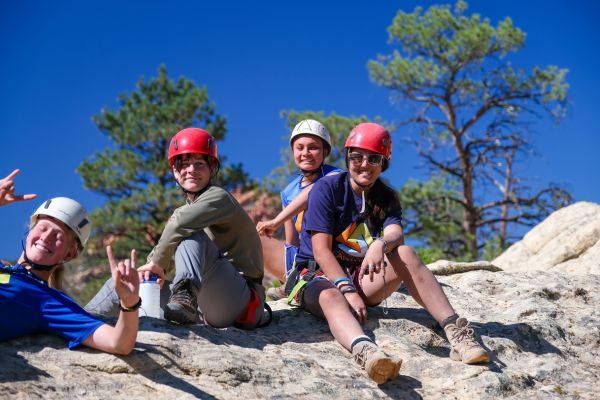 Clients enjoying a guided rock climbing adventure at Legacy Outdoor Adventures' outdoor residential addiction treatment program.